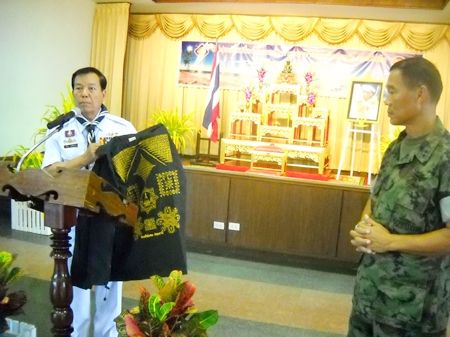 Rear Adm. Samak Noophairoj, scouts club president, presents vests covered in good luck symbols to Marine Corps Training Center commander, Vice Adm. Phongsak Phuririj. 
