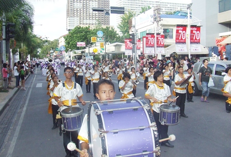 Marching bands march down Beach Road trying to be the best of the Thailand International Marching Band Competition. 