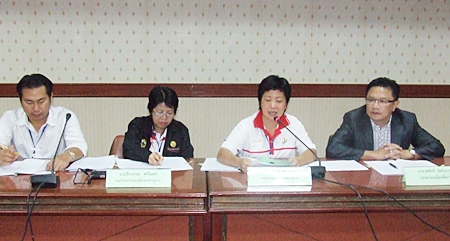 Deputy Mayor Wutisak Rermkitkarn (right) leads a committee working with local charities to assist low-income youths. 