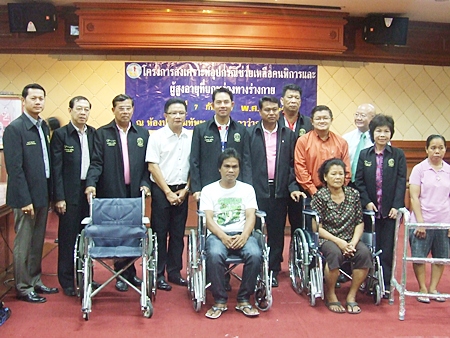 Mayor Itthiphol Kunplome presides over the distribution of 263 pairs of glasses, four wheelchairs and five walkers to elderly, disabled and visually impaired residents. 