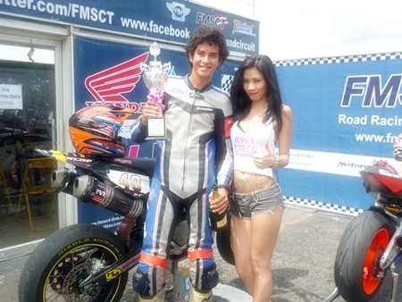 Ben Fortt holds the trophy after his win at the Thailand circuit, Sunday, Sept. 18. 