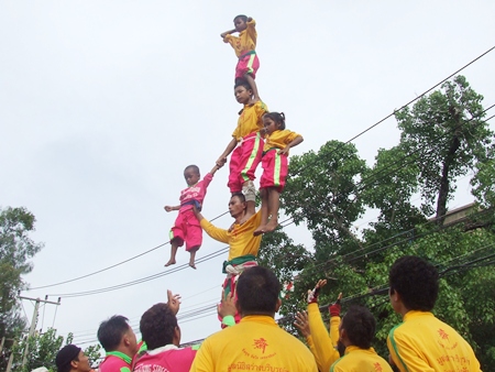 This human pyramid raises the children high into the sky.