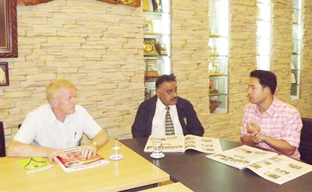 (L to R) Gudmund Eiksund, president of the Rotary Club of Jomtien-Pattaya, and Peter Malhotra, MD of the Pattaya Mail Media Group work with Mayor Itthiphol Kunplome on ways to help flood victims in Central Thailand.