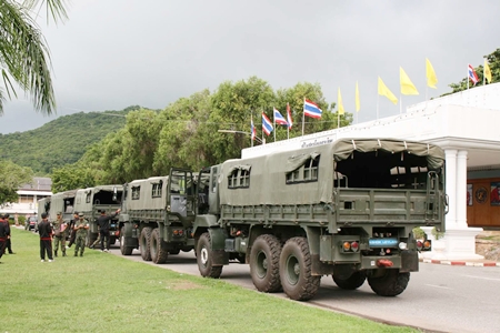 With dark skies as a backdrop, the navel convoy prepares to leave to assist flood-relief efforts in Ayutthaya. 