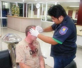 A rescue worker stitches up Barnes after his encounter with a Beach Road transvestite.