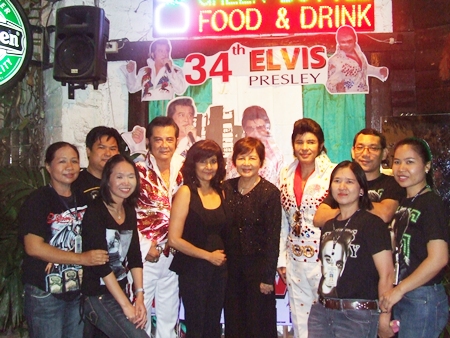 Two of Pattaya’s Elvis impersonators, Jaluk Viriyakit and Jeerasak Pinsuwan, pose for a photo with Green Bottle owner Sopin Thappajug and friends.