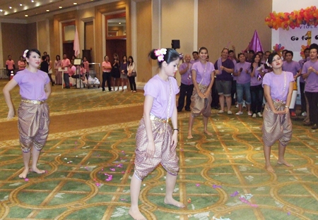 Some of the members of the purple team perform traditional Thai dance.