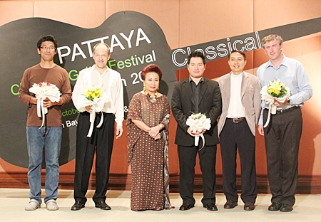 (Left to right): Tomonori Arai, Leon Koudelak, Kamala Sukosol, president of Siam Hotels & Resorts, Monching Carpio, Father Peter Srivorakul, acting president of the father Ray Foundation; and Paul Cesarczyk appear on stage at the conclusion of the 2011 guitar festival.