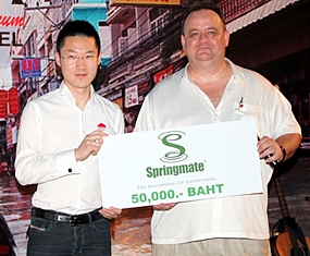 Nophol Techaphangam (Vice MD Springmate) hands a donation of 50,000 baht to Michael Procher (GM Nova Platinum Hotel, Amari Nova Suites Pattaya and Nova Gold Hotel).   