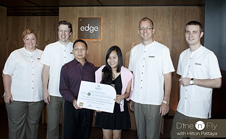 Kanthicha Pichaikamchornvud (3rd left) stands proudly with her father Wallop Pichaikamchornvud as she receives the top prize in the hotel’s promotional campaign ‘Dine ‘n’ Fly with Hilton Pattaya’. Her prize included return airfare for two, two nights’ accommodation and daily breakfast at Conrad Koh Samui. On hand to witness the handover were Peta Ruiter, Director of Business Development, Michel Scheffers, Director of Operations, Harald Feurstein, General Manager, Hilton Pattaya and Simon Bender, Food & Beverage Manager.