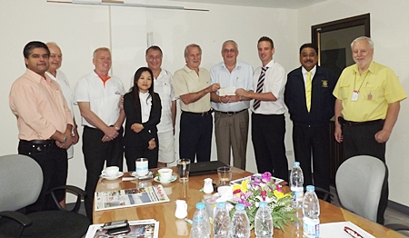 Steve Graham (4th right) MD of Securitas Thailand is flanked by William Macy (Pattaya Sports Club) and Andrew Emerey (St Andrews International School) who contributed 50,000 baht and 100,000 baht respectively towards the Pattaya Relief Fund. Members of the Pattaya Relief Group are (l-r) Tony Malhotra, Ferenc Fricsay, Gudmund Eiksund, Rungarun Harnnarong, Carl Dysin, Peter Malhotra and John Cole.