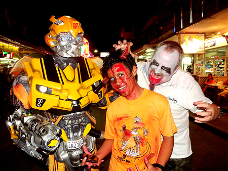 Zombie Wuthisak Phanumran is surrounded by transformers and foreign flesh eating zombies.