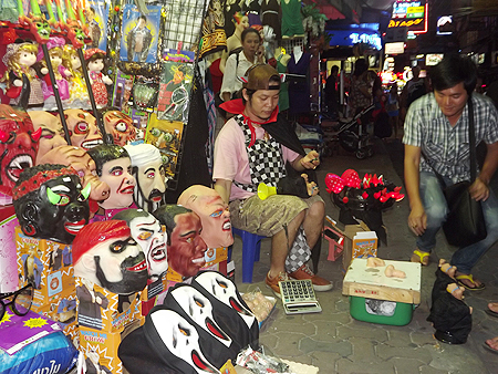 Sales of Halloween masks are brisk on All Hallows Eve.