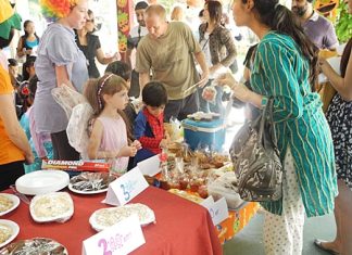 Rebecca and Enzo running the bake sale.