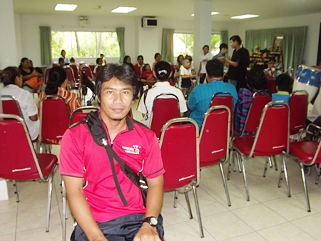 Sumreng Khruemai, a wheelchair tennis athlete, waits for the waters to recede from his home along the overflowing Chao Phraya River in Minburi, so he can resume training for the upcoming Asian Games in Indonesia.