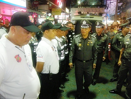 Acting Region 2 police chief Lt. Gen. Punya Mamen walks the entire length of Walking Street, shaking hands, posing for photographs and thanking officers for ensuring safety. 