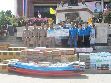 Officials from the Navy receive donated goods from the mayor and Walking Street committee to help flood-relief efforts around Thailand.