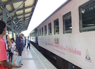 Passengers prepare to board the train at Pattaya Station off Siam Country Club Road.