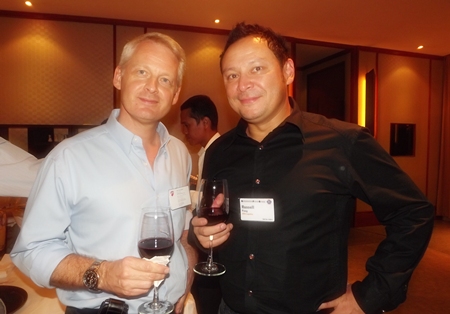 Alain Deurwaerder enjoys a drink with Russell Pang.