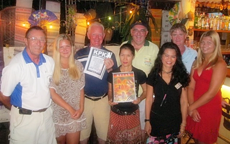 Tuesday’s winners pose with the staff at The Relax Bar. 