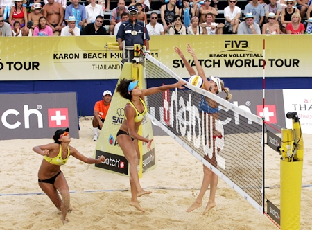 China’s Chen Xue and Xi Zhang (left court) take on the USA pairing of Jennifer Kessy and April Ross in the final of the 2011 Phuket Thailand Open at Karon Beach, Phuket, on Sunday, November 6. 