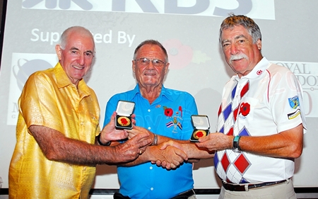 The Chairman, Derek Brook (center) presents  special medals from The Royal British Legion to tournament winners Les Charles & Barry Oats.
