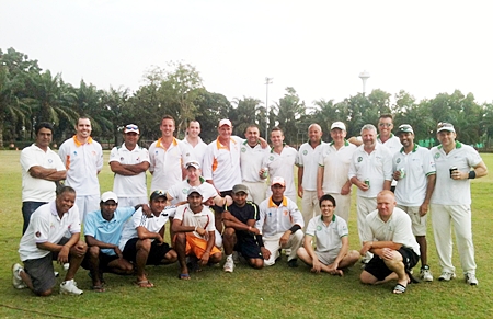 Pattaya Cricket Club and Siam C.C. players pose for a group photo at the Horseshoe Point ground in Pattaya, Saturday, November 12. 