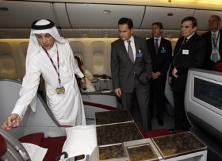 Qatar Airways Chief Executive Officer Akbar Al Baker, left, with French Minister of Industry, Energy and the Digital Economy, Eric Besson, onboard one of the airline’s Boeing 777’s on static display at the Dubai Air Show.