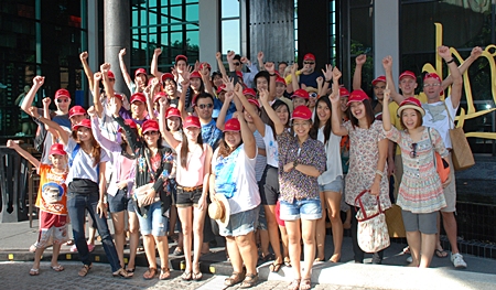 The Red team poses for a photo in front of Mantra Restaurant & Bar before boarding the boats.