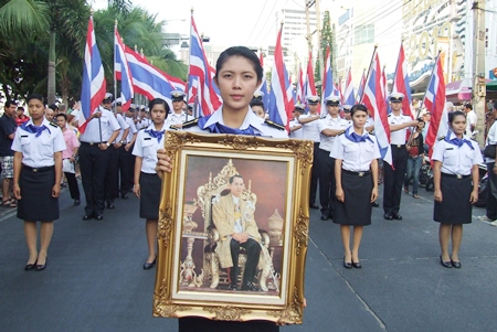 Navy cadets from the Raja Navy Commercial School carry a revered photo of HM the King in the annual parade down Pattaya Beach Road.