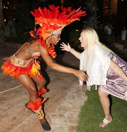 One of the guests starts shaking her body along with one of the colorful Brazilian Zico’s dancing girls.
