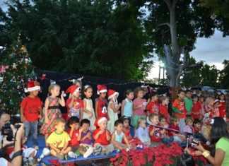 The children happily entertain their parents with “Jingle Bells Rock!”