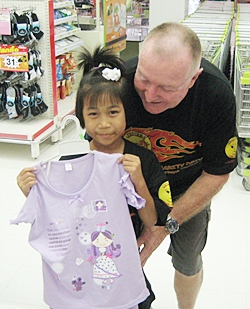 Erle Kershaw helps this little one pick out a dress.