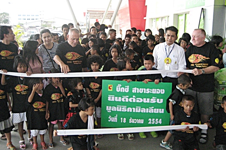Trying to assemble this many children for a group photo handling the lengthy store receipt is no small task.