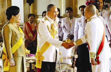 His Majesty the King is congratulated by Cambodian King Norodom Sihamoni as HM Queen Sirikit, looks on at the Ananda Samakhom Throne Hall in Bangkok Monday, June 12, 2006.