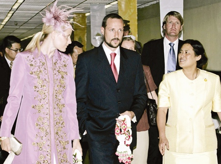 Norwegian Crown Prince Haakon, center, and Crown Princess Mette Marit, left, are welcomed by HRH Princess Maha Chakri Sirindhorn upon their arrival at the Bangkok International Airport in Thailand Sunday, June 11, 2006.