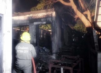 Firefighters put out the remaining embers in a hotel storage room fire that caused approximately 300,000 baht in damage.