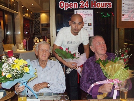 Archie Dunlop (left) and Dennis Dewsnap (right) receive flowers for their permanent help with donations.