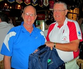 Dick Warberg (right) presents The MBMG Golfer of the Month award to Brian Parrish.