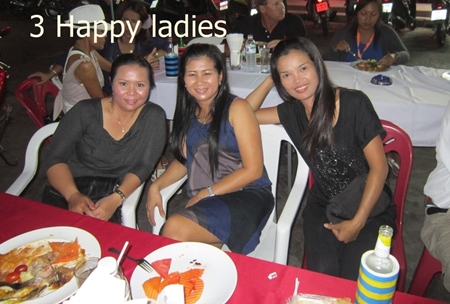 A trio of ladies enjoy the after-golf party.