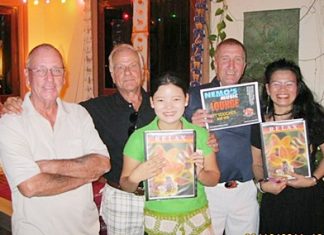 Weekly winners celebrate with the staff at the Relax Bar.