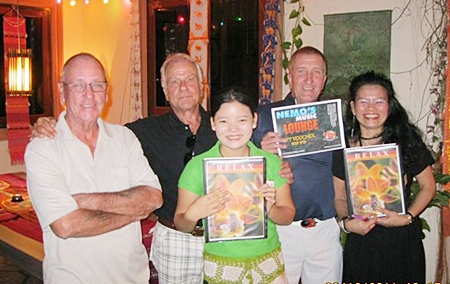 Weekly winners celebrate with the staff at the Relax Bar.