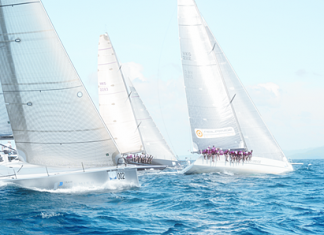 ‘Team Premier’ (left) attempts to make up ground on ‘Freefire’ (center) and ‘Hi Fi’ (right) during the final day of racing at the 25th Phuket King’s Cup Regatta.