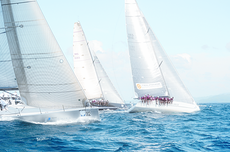 ‘Team Premier’ (left) attempts to make up ground on ‘Freefire’ (center) and ‘Hi Fi’ (right) during the final day of racing at the 25th Phuket King’s Cup Regatta.