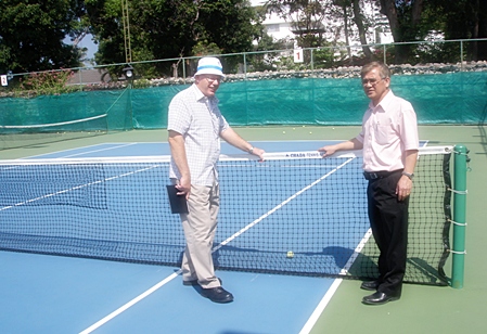 Geoffrey Rowe, Tournament Director of the PTT Pattaya Open, (left) inspects the tennis courts at the Dusit Thani Pattaya in preparation for the 2012 event being held from 5–12 February. 