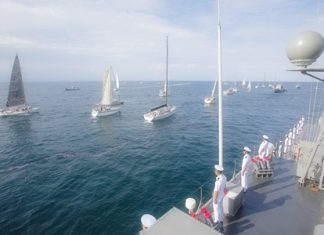 The 25th Phuket King’s Cup Regatta fleet sails past HTMS Chonburi in salute of His Majesty the King’s 84th birthday, Monday, December 5. (Photo/Guy Nowell)