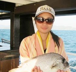 Noi holds the scribe’s prize catch.