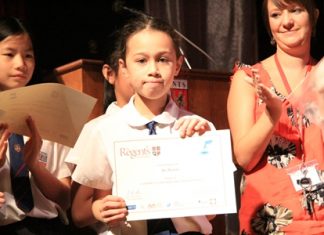 Competition winner Bel Walton receiving her certificate.