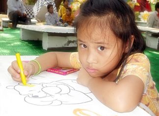 This little one is coloring inside the lines during one of the many activities held throughout Pattaya for this year’s Children’s Day. Prime Minister Yingluck Shinawatra advised Thailand’s children to obtain “Unity, knowledge, and wisdom, whilst preserving Thai identity and learning technology” in her message to children on this special day.