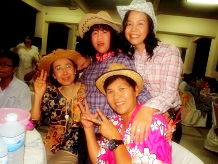Teachers and staff at Photisampan Pittayakarn School let down their hair for a fun-filled New Year party. 